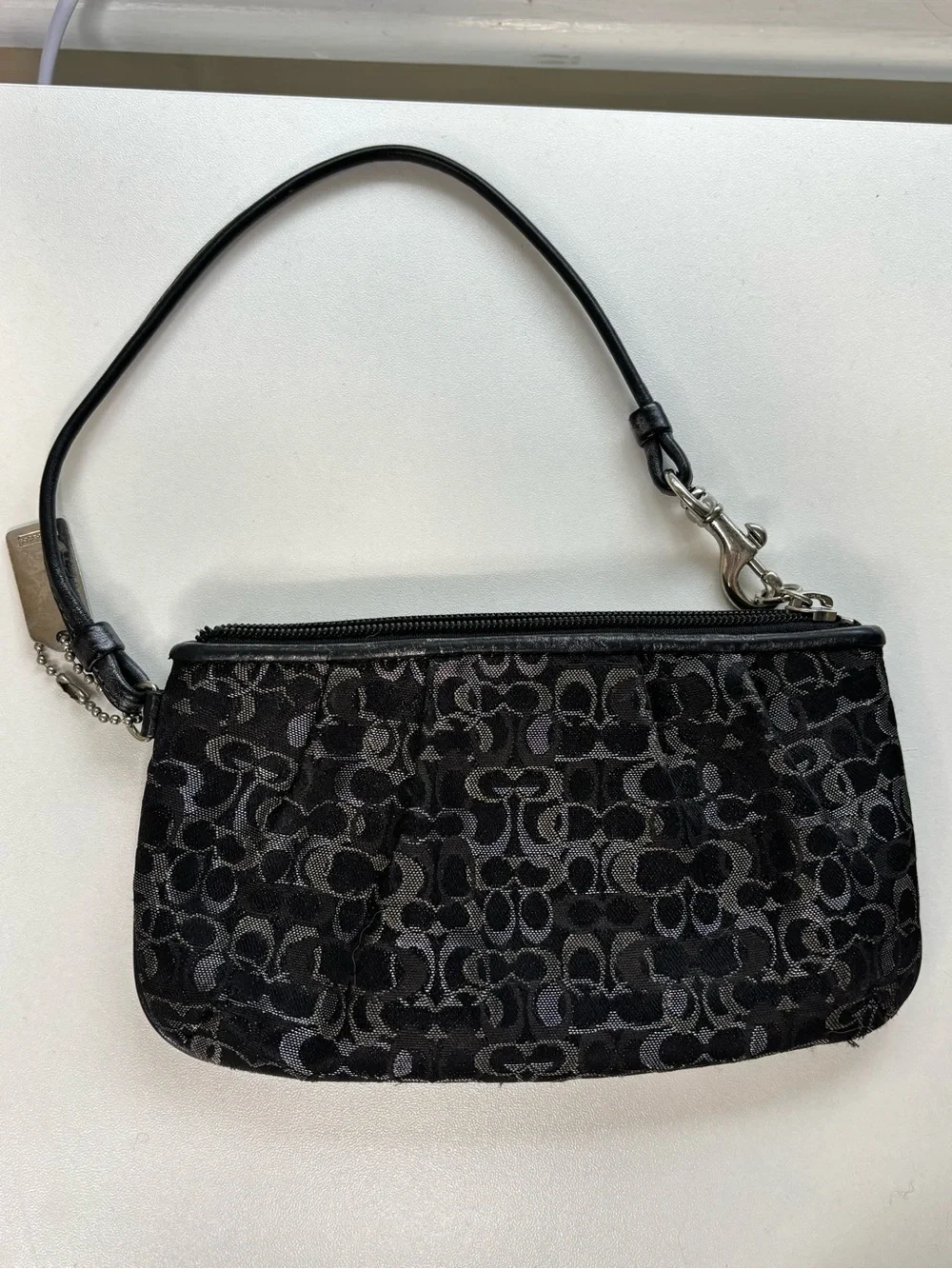 Coach, Black and silver lurex wristlet pre owned loved . Vintage